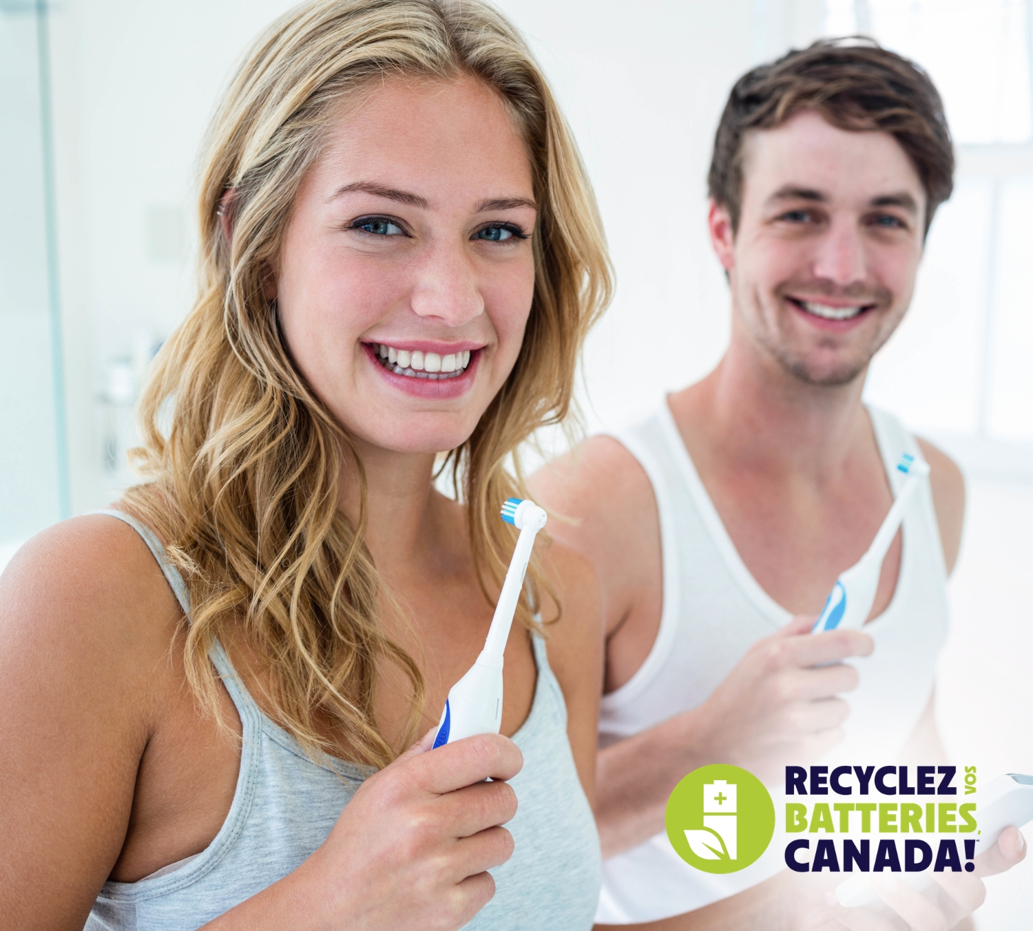 Couple using an electric toothbrush
